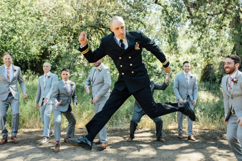 Groom Jumping For Joy On Wedding Day