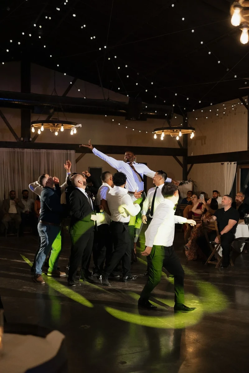 Groom Tossing the Garter to the Groomsmen