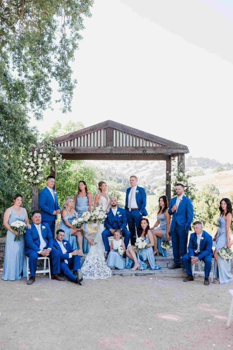 Bride and Groom with Wedding Party at the Ceremony Arbor